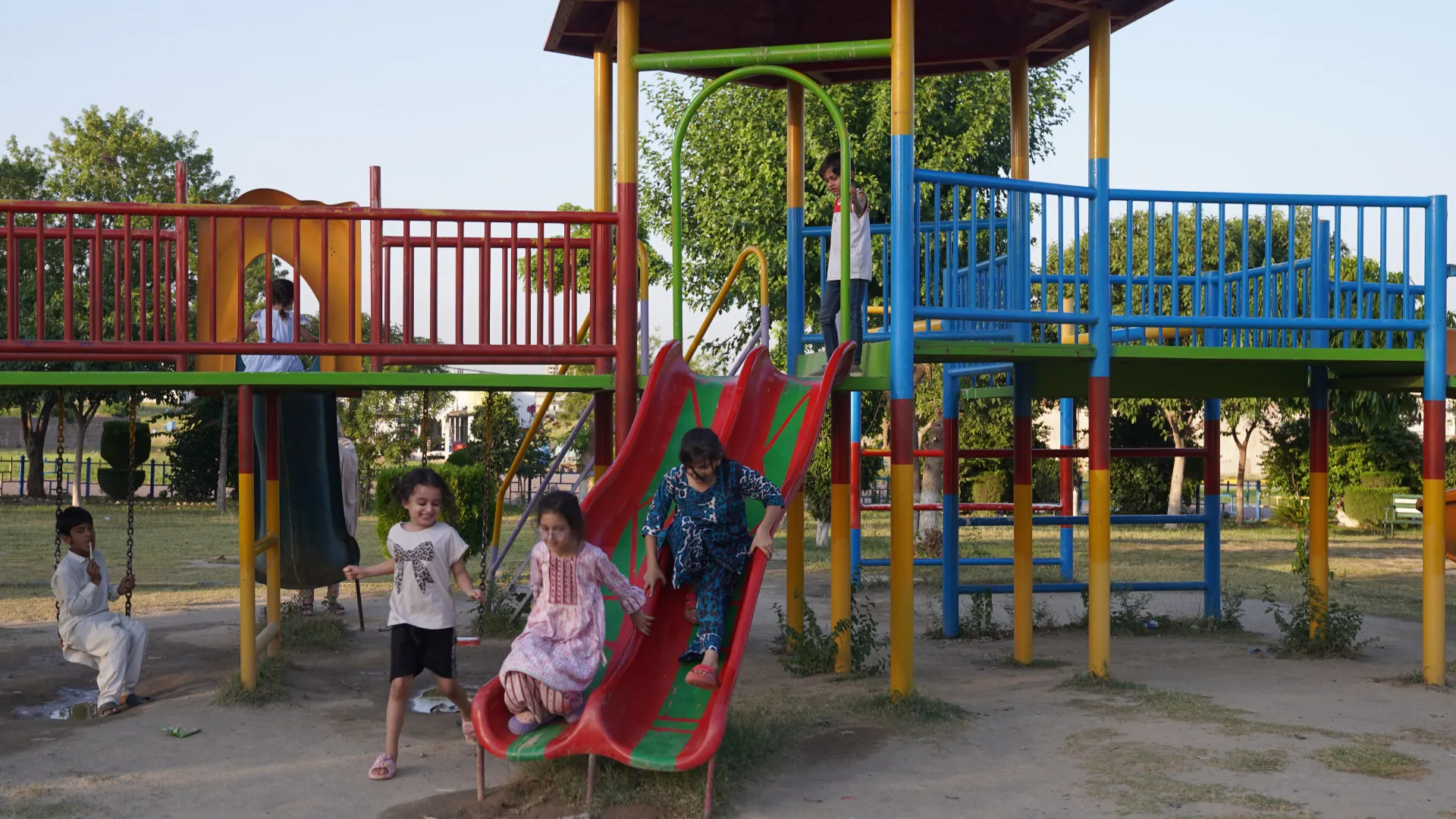 Children on the slides of a park playground